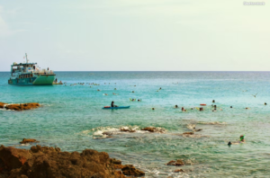 Tourists snorkeling in the Caribbean Sea on St Maarten, St Martin, things to do in the water St Maarten