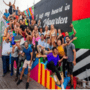 Big Group standing in front of a wall painting during the Island Street Art Tour.