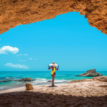 Lady in a cave under the pink cliffs of Cupecoy St Maarten