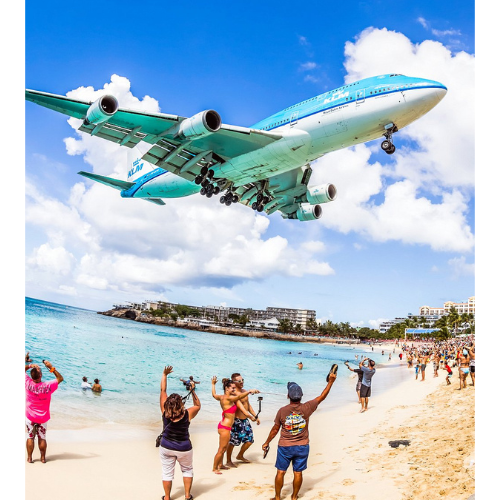 Plane landing over Maho beach in beautiful St Maarten weather