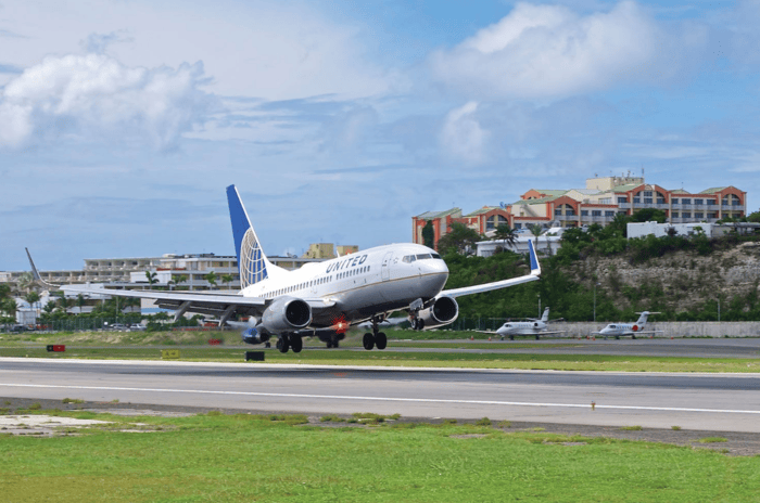 United Airlines on the runway at Princess Juliana International Airport