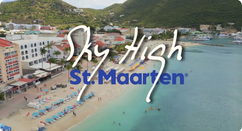 picture of beach and sea st maarten with the logo og sky high st maarten in it